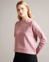 LIVANAA-Tops-Who says you can't be comfortable and chic? With a crew neck, long sleeves and embossed logo detail, LIVANAA is the staple sweatshirt that your wardrobe has been craving. Sweatshirt Embossed Ted Baker logo Crew neck Long sleeves Ayo is 5'8" / 1.73m and wears Red in a Ted size 1- Ted Baker Romania